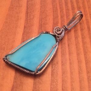 Turquoise stone and silver pendant